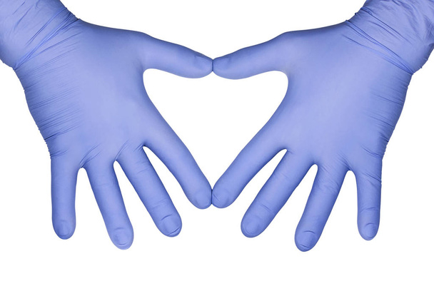 Concepto de salud: manos en guantes de látex médicos azules
 - Foto, imagen