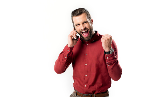 portrait of excited man talking on smartphone isolated on white - Photo, Image