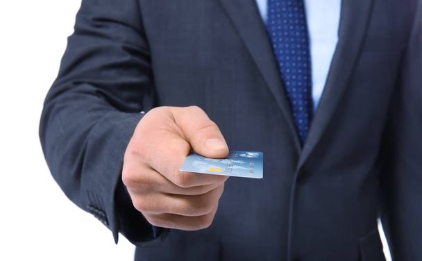 Man holding credit card on white background, closeup - Фото, зображення