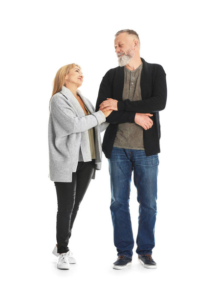 Mature couple in casual clothes walking on white background - Foto, immagini
