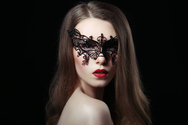 portrait of mysterious woman in lace mask on black background - Fotoğraf, Görsel