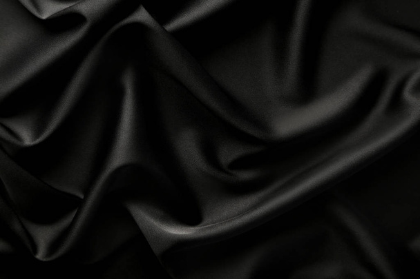 Close view of tumbled black satin fabric - Fotografie, Obrázek