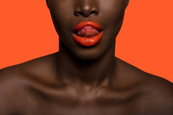 concept of colors on afro black skin woman with red lipstick  - 写真・画像