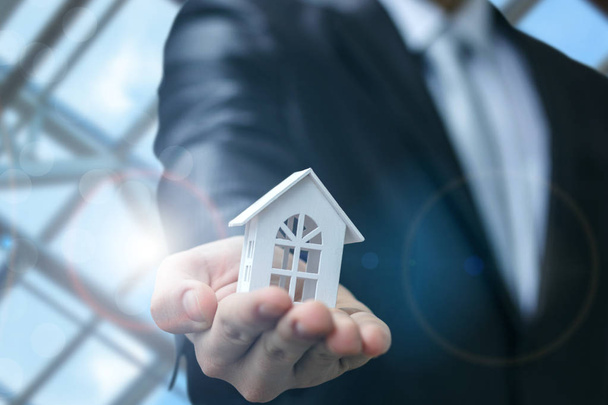 Real estate agent shows the house model . - Φωτογραφία, εικόνα