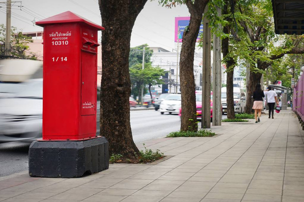 Red mailbox on the side walk. - Photo, Image