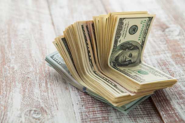 dollars  on a wooden background - Foto, Imagem