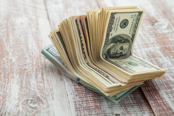 dollars  on a wooden background - Foto, Imagem