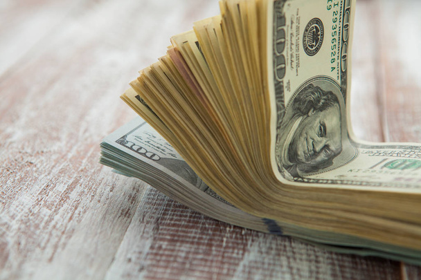 dollars  on a wooden background - Foto, imagen