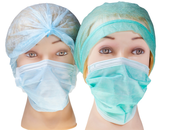 Tekstil cerrahi kep ve maske takan aptal doktor kafa - Fotoğraf, Görsel