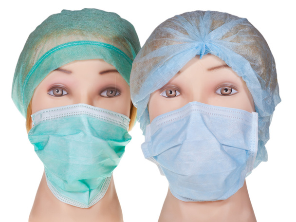 Дурацкая голова доктора в текстильной хирургической шапке и маске
 - Фото, изображение