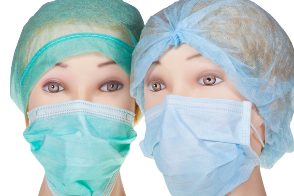 Маньчжурські голови лікарів носять текстильну хірургічну шапочку та маску
 - Фото, зображення