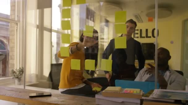 4K Young casual business team working and brainstorming in creative city office - Video