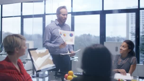 4K Corporate business team in early morning meeting with food and refreshments - Video