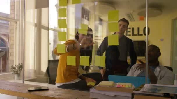 4K Young casual business team working and brainstorming in creative city office - Video