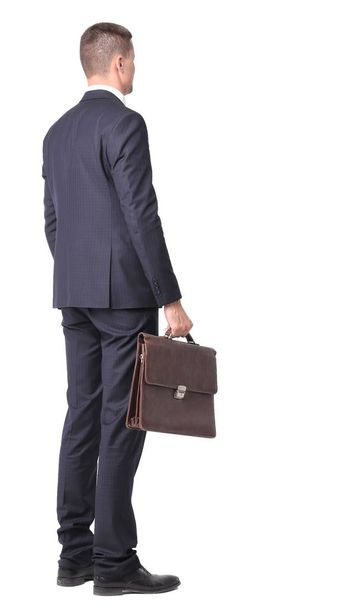 side view.portrait of confident businessman with briefcase - Фото, зображення