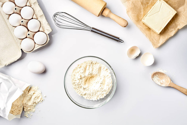 Baking ingredients for pastry on the white table - Foto, imagen
