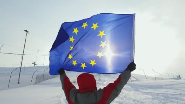 Middle-aged man sport fan waving an European Union flag - Footage, Video