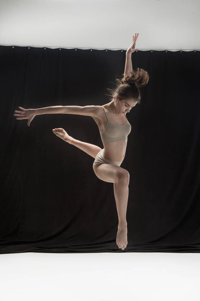 Young teen dancer on white floor background. - Foto, immagini