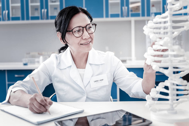 Enthusiastic female scientist conducting genetic research - Photo, image