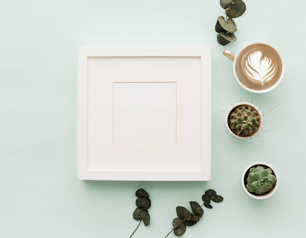 Mockup Neutral Minimalist Flat Lay Scene With coffee, frame and cactus  - Фото, зображення