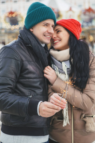 Cute cheerful loving couple smiling, hugging and kissing outdoor - Foto, Imagem
