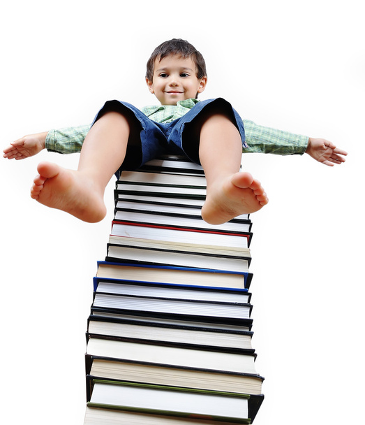 A little cute kid and large number of books - Zdjęcie, obraz