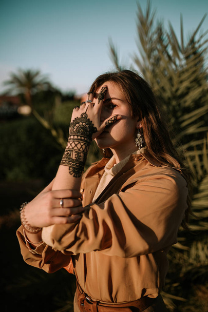 Young woman with a henna tattoo - Fotó, kép