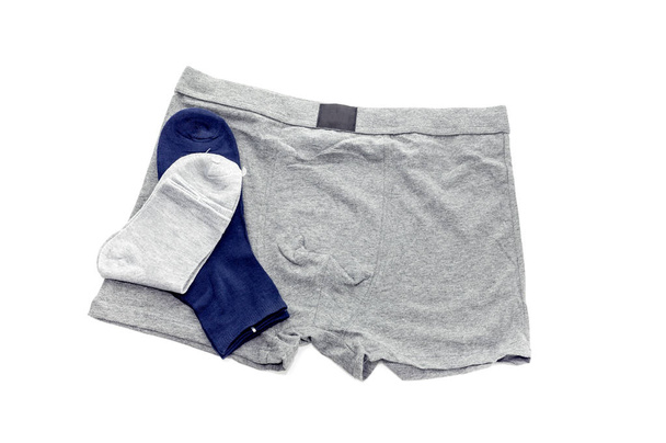 Серые мужские трусики и носки
  - Фото, изображение