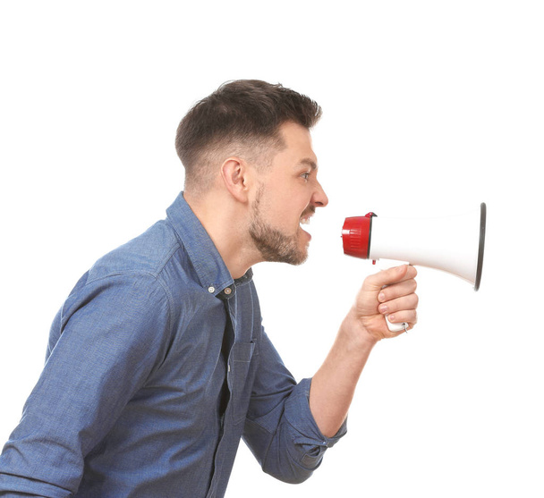 Angry man using megaphone against white background - Fotoğraf, Görsel