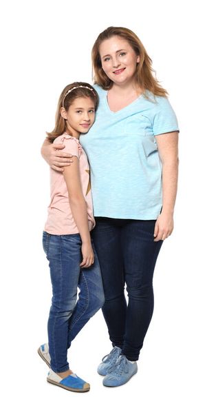 Full-length portrait of happy mother and daughter on white background - Photo, Image
