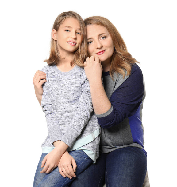 Portrait of happy mother and daughter on white background - Valokuva, kuva