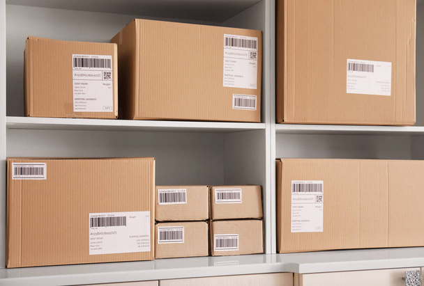 Shelving with parcels ready for shipment to customers in home office. Startup business - Fotografie, Obrázek