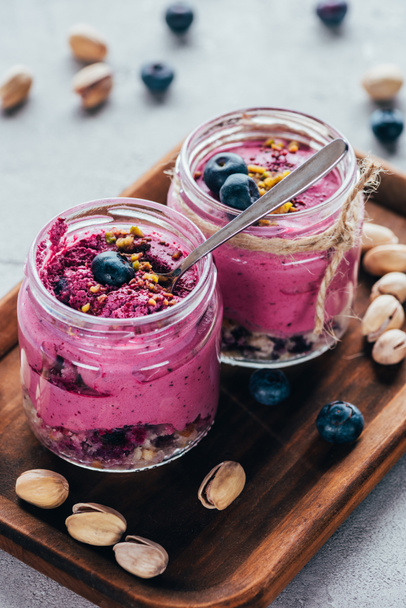 close-up view of delicious healthy pink smoothie with nuts  - Φωτογραφία, εικόνα