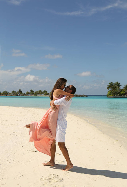 love story photo of beautiful couple relaxing in Maldives island - Valokuva, kuva