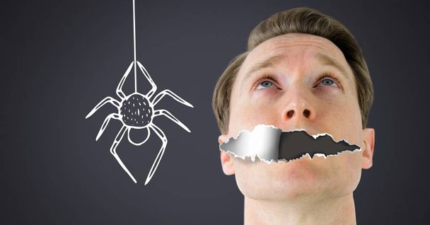 Digital composite of Arachnophobia fear Man with torn paper on mouth and scary spider drawing - Photo, Image
