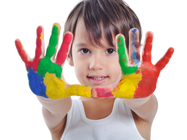 A little cute child with colors on white - Fotó, kép