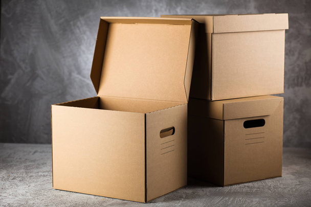 Cardboard box on grey background - Фото, зображення
