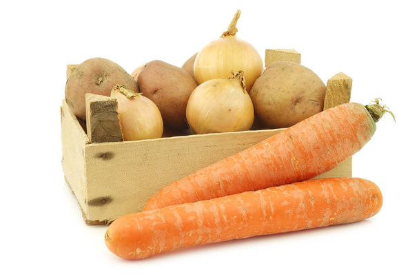 Mixed root vegetables for making "hutspot" in a wooden crate on a white background - Photo, Image
