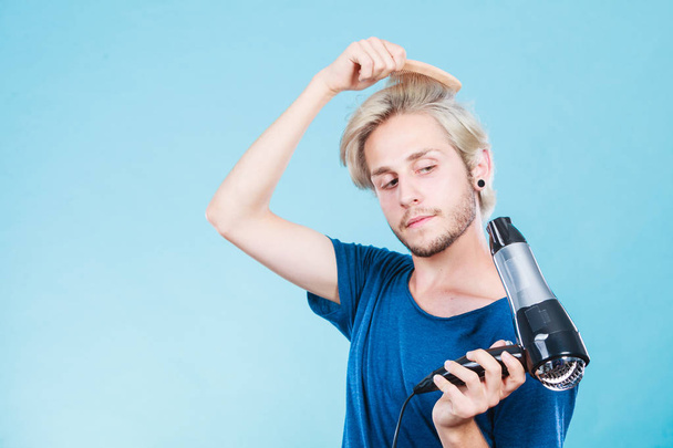 Trendy man with hair dryer - Фото, изображение