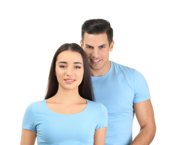 Young man and woman in stylish t-shirts on white background. Mockup for design - Zdjęcie, obraz