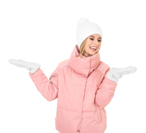 Young woman in warm clothing on white background. Ready for winter vacation - Foto, immagini
