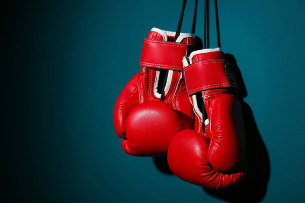 Boxing gloves on color background - Foto, Imagen