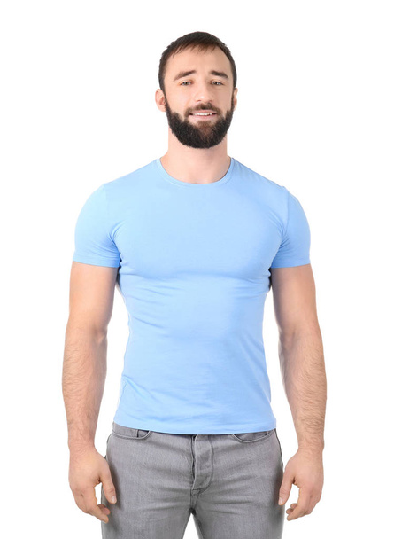 Young man in stylish t-shirt on white background. Mockup for design - Foto, imagen