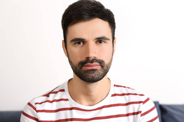 Young bearded man in casual clothes indoors - Foto, immagini