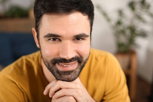 Young bearded man in casual clothes indoors - Fotoğraf, Görsel