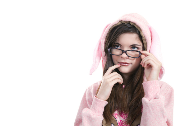 Portrait of teenage girl wearing glasses, smiling benevolently - 写真・画像