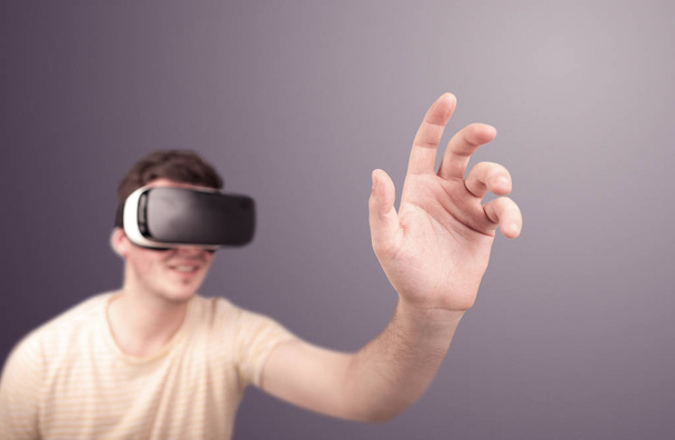 Man wearing virtual reality goggles - Foto, afbeelding
