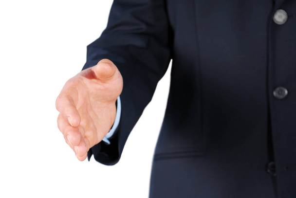 Closeup of a businessman in black suit giving hand for handshake, isolated on white - Φωτογραφία, εικόνα