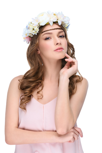young woman with curly hair in floral wreath isolated on white - Photo, Image