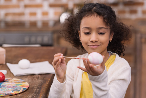 african american kid painting easter egg - Photo, Image